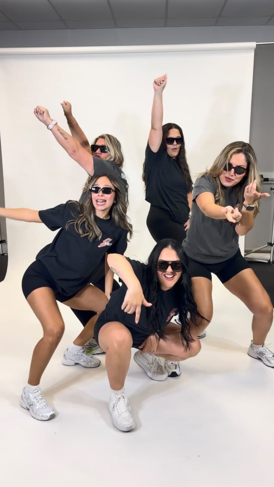 The crew in sunglasses, striking a pose